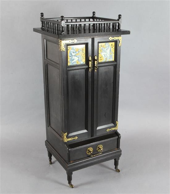 An Aesthetic movement ebonised music cabinet, in the manner of Morris & Co., W.30in.